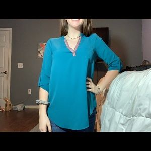 Teal V-neck shirt